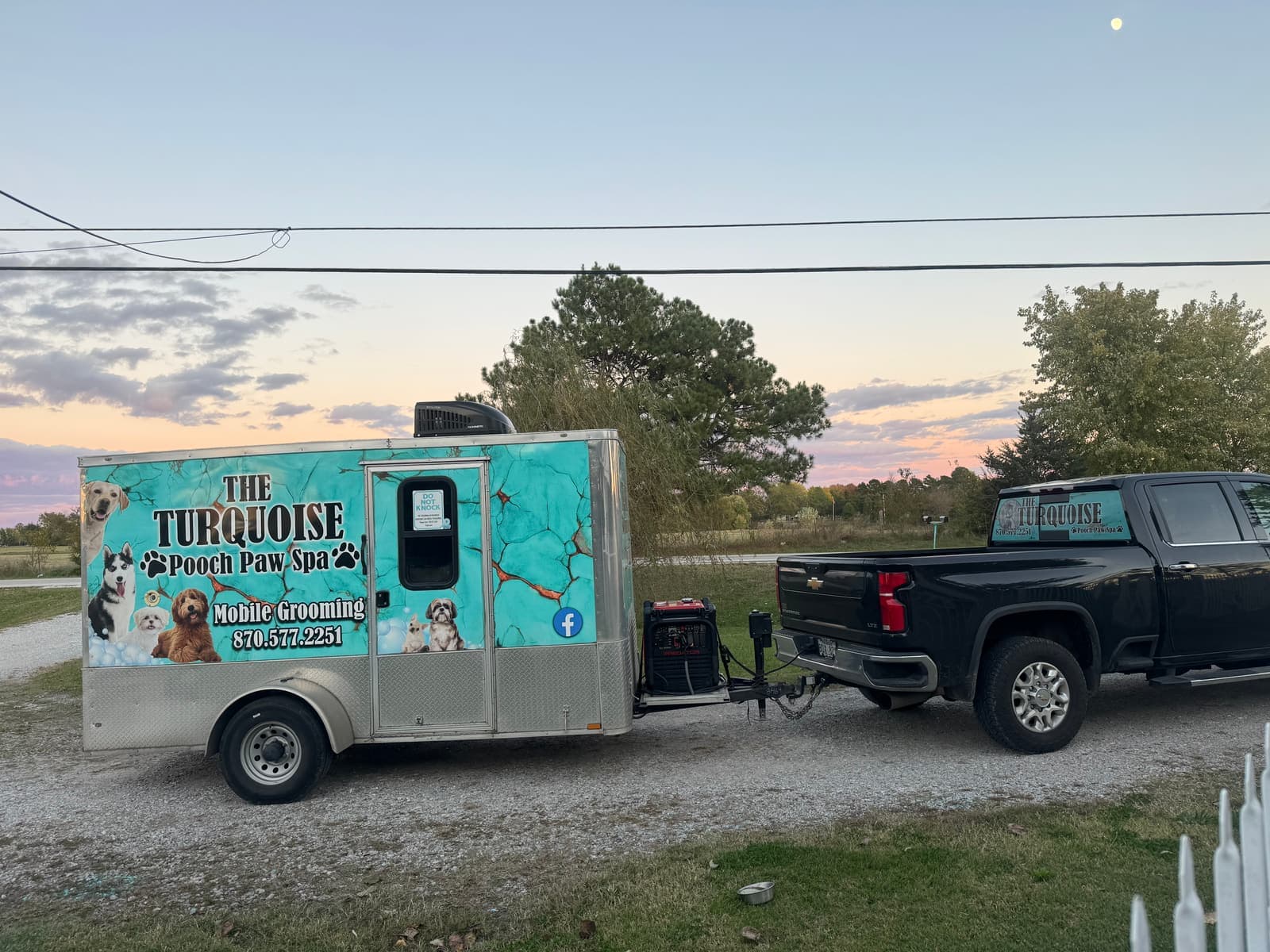 Turquoise Pooch mobile grooming unit at sunset on the road across Northwest Arkansas
